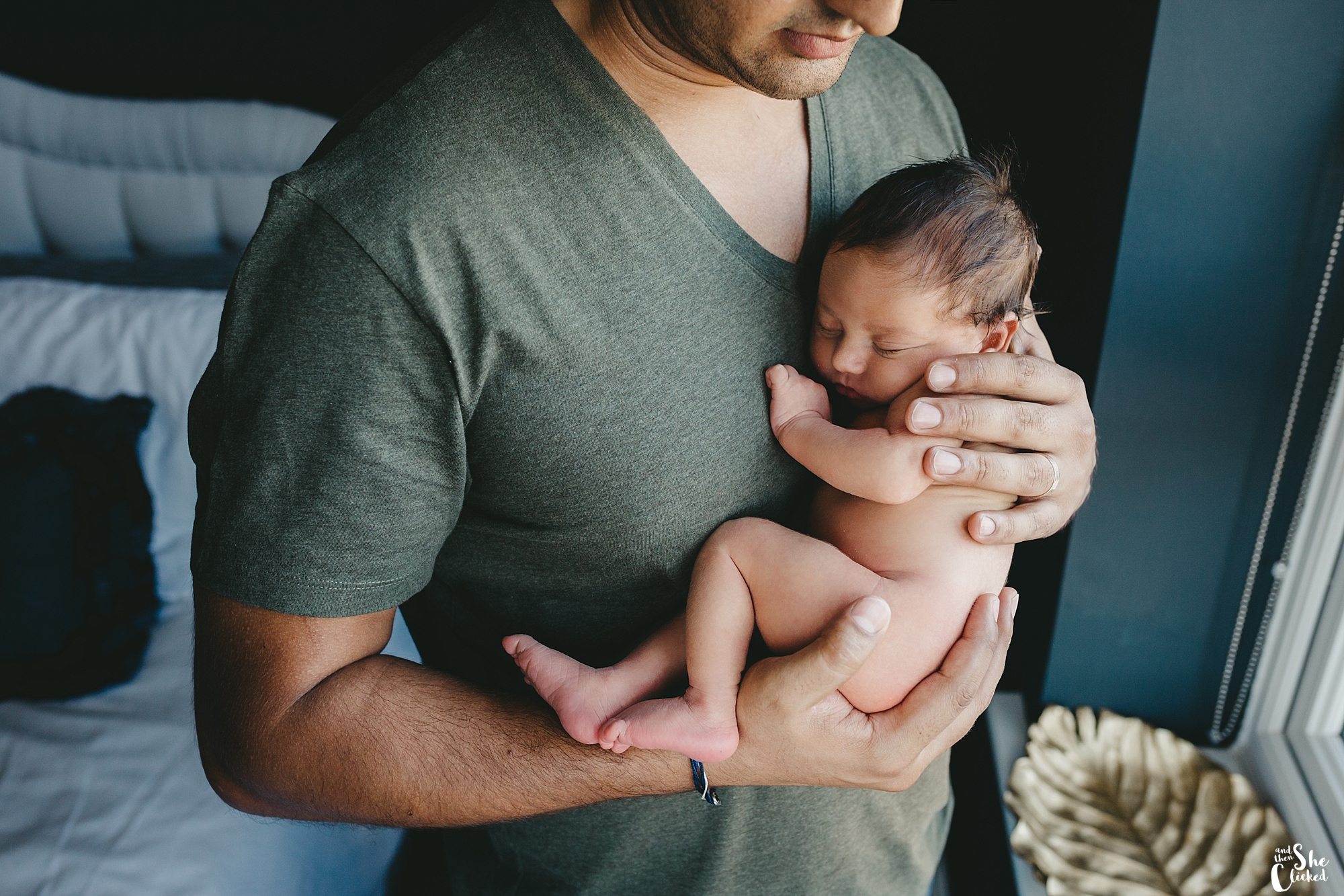 dad holding baby lifestyle newborn