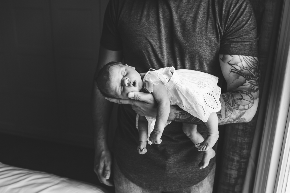 tattood dad with newborn