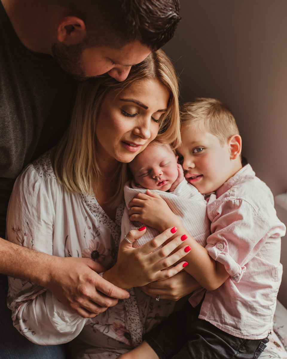 connection family hug on newborn photoshoot