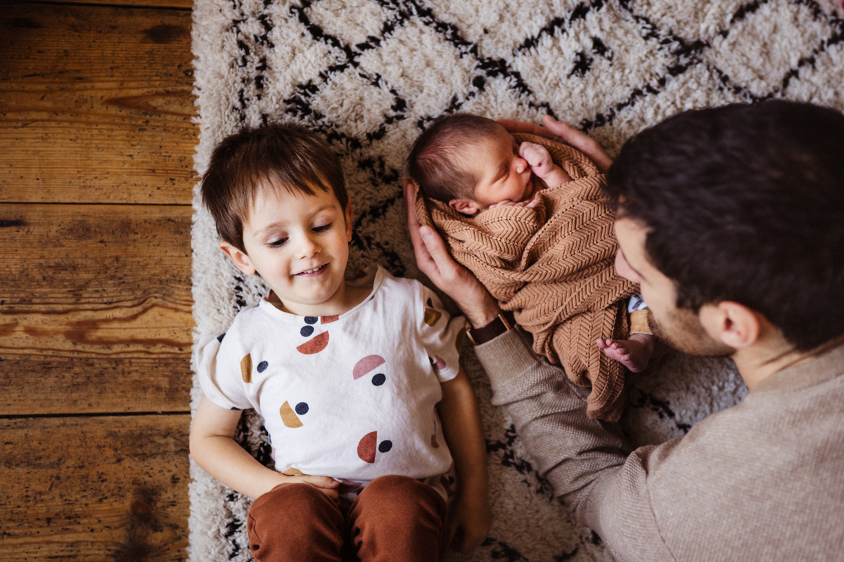 newborn family photograph with sibling