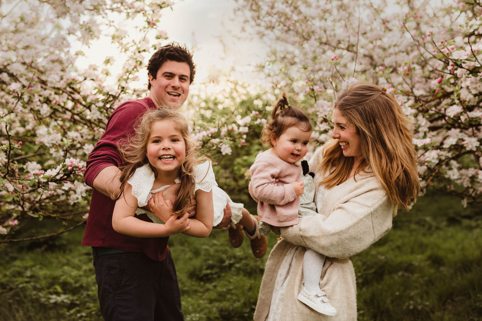 family playing in the blossom trees berkshire